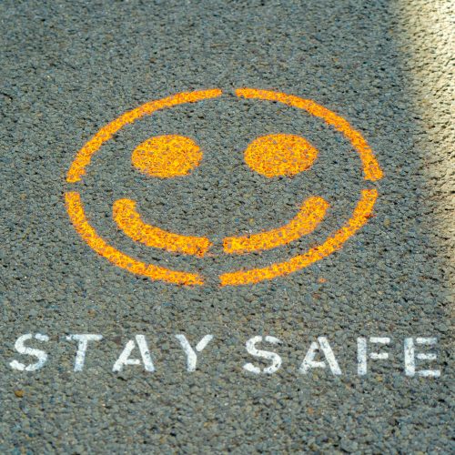 Stay safe message and smiley face image