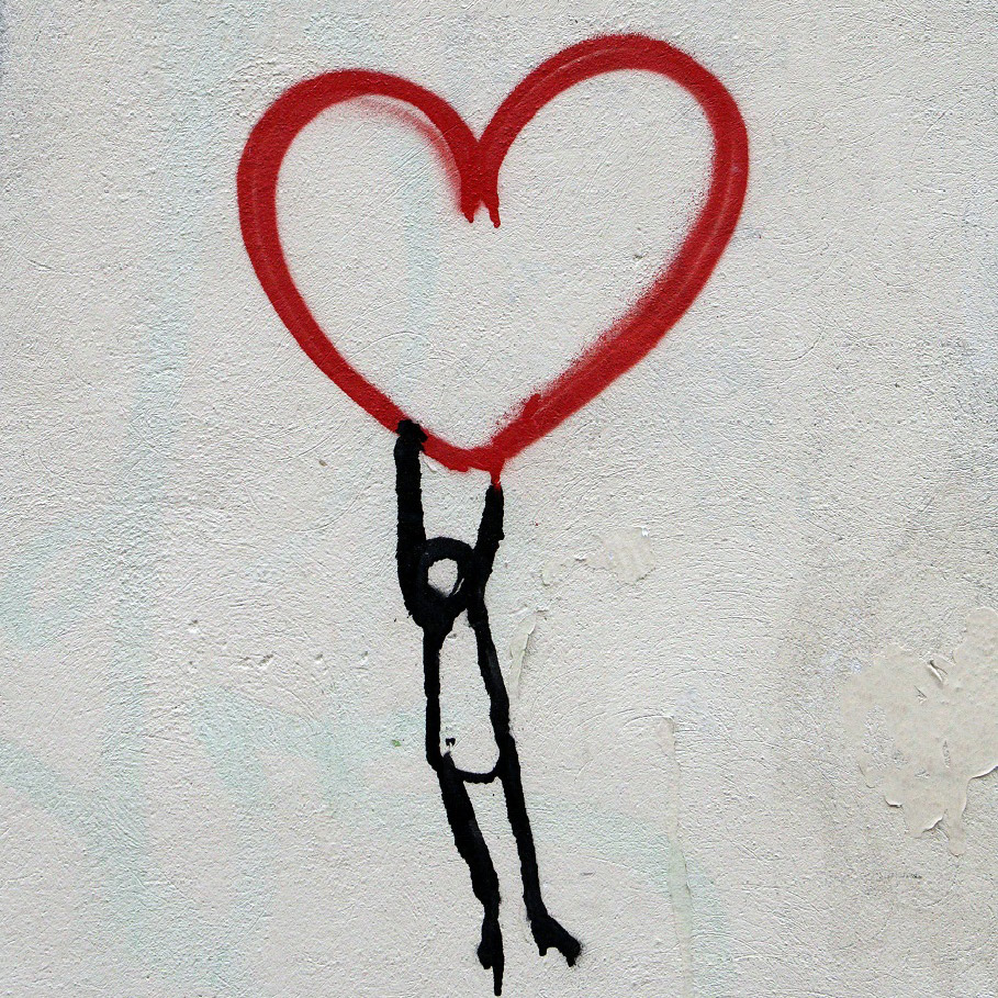 A hand-drawn picture by Nick Fewings of a person hanging or swinging from a red heart